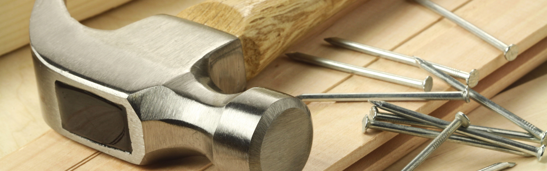 Hammer and Nails on Wooden Planks